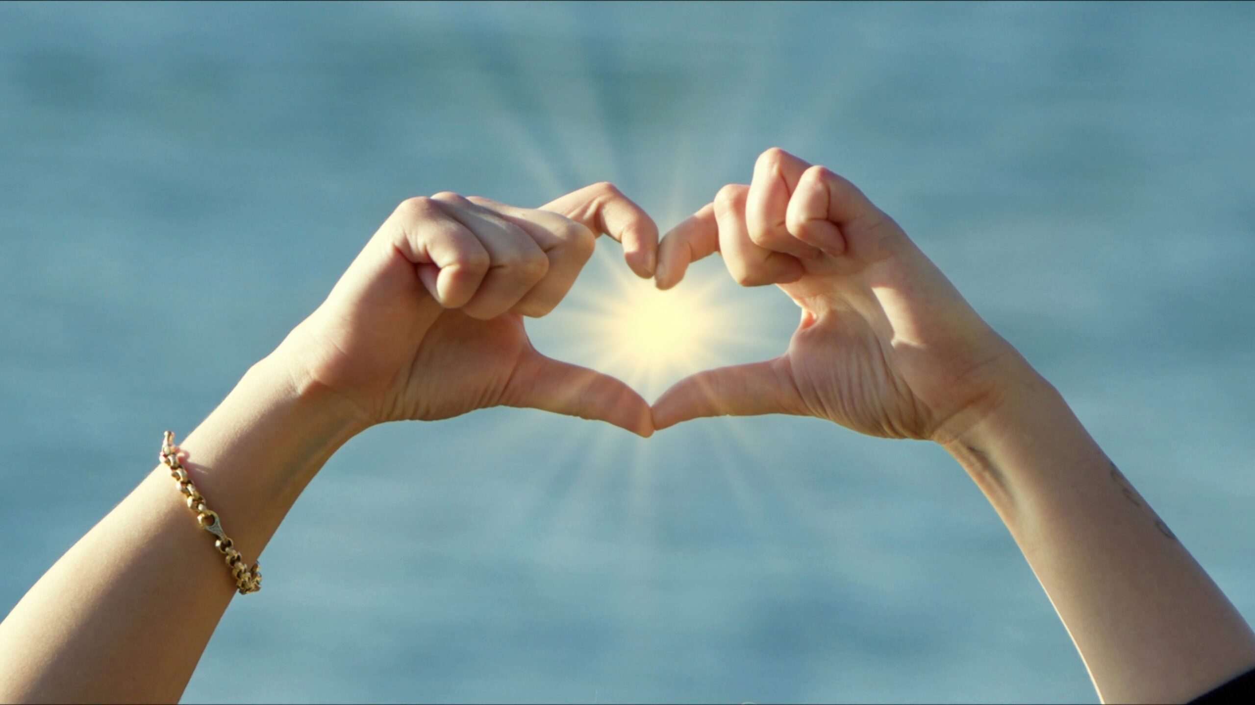 A Young Woman Hand Makes Heart Shape with Fingers